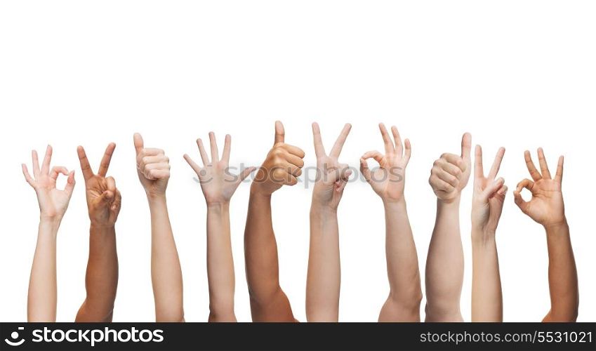 gesture and body parts concept - human hands showing thumbs up, ok and peace signs