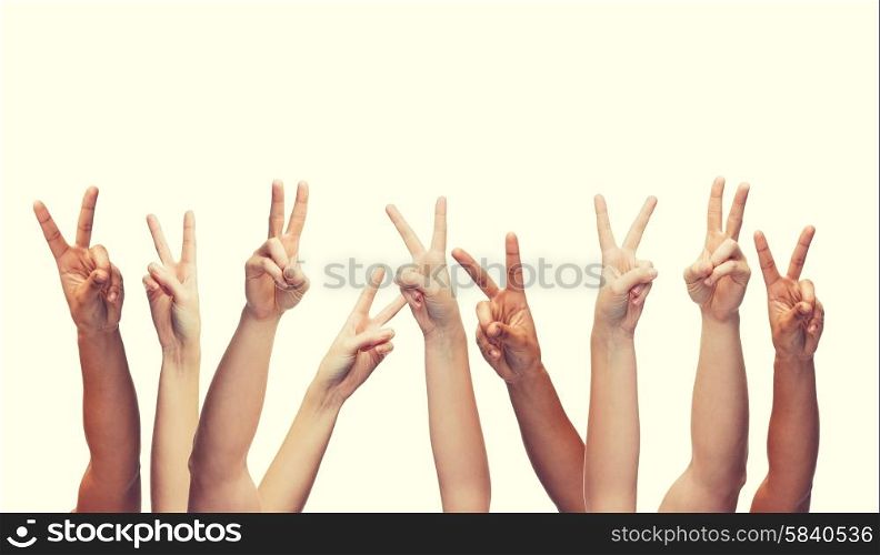 gesture and body parts concept - human hands showing v-sign. human hands showing v-sign