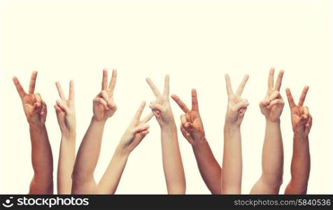 gesture and body parts concept - human hands showing v-sign. human hands showing v-sign