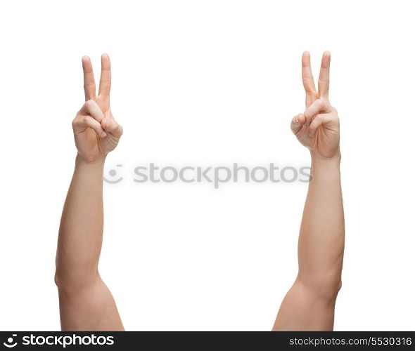 gesture and body parts concept - man hands showing v-sign