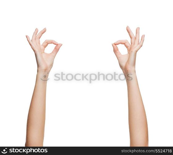gesture and body parts concept - woman hands showing ok sign