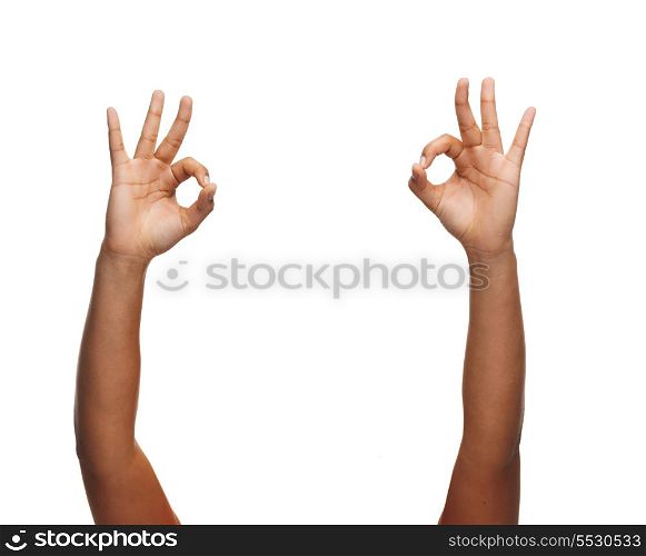 gesture and body parts concept - woman hands showing ok sign