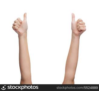 gesture and body parts concept - woman hands showing thumbs up