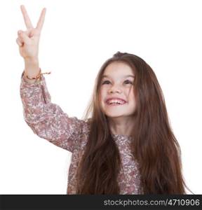 Gesture and happy people concept - smiling little girl in dress showing peace gesture with fingers, studio on white background