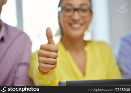 gesture and people concept - close up of happy young woman with tablet pc computer showing thumbs up. happy young woman with tablet pc showing thumbs up