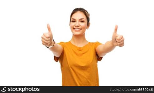 gesture and people concept - happy smiling young woman or teenage girl in orange t-shirt showing thumbs up over white background. woman or teenage girl in t-shirt showing thumbs up