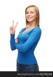 gesture and people concept - smiling teenage girl showing v-sign with hand