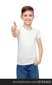 gesture, childhood, fashion, advertisement and people concept - happy smiling boy in white blank t-shirt showing thumbs up