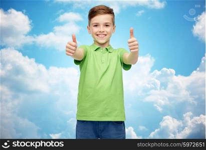 gesture, childhood, fashion and people concept - happy smiling boy in green polo t-shirt showing thumbs up over blue sky and clouds background