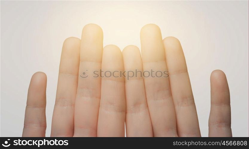 gesture, family, count and body parts concept - close up of hands showing eight fingers