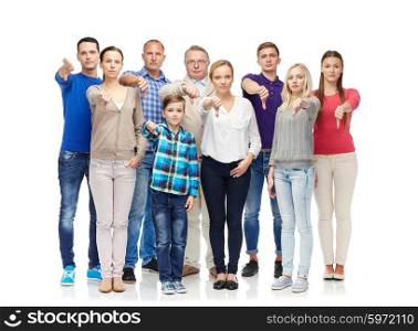 gesture, family, gender, generation and people concept - group of men, women and boy giving thumbs down