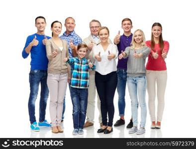 gesture, family, generation and people concept - group of smiling men, women and boy showing thumbs up