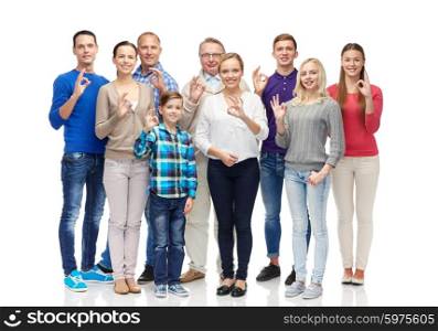 gesture, family, generation and people concept - group of smiling men, women and boy showing ok hand sign