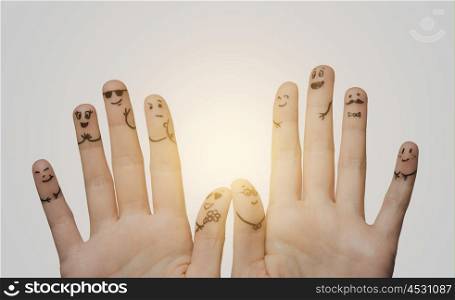 gesture, family, wedding, people and body parts concept - close up of two hands showing fingers with smiley faces