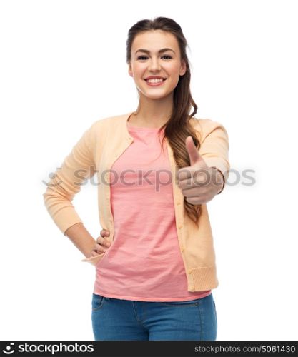 gesture, fashion, portrait and people concept - happy smiling young woman in cardigan showing thumbs up over white. happy smiling young woman showing thumbs up
