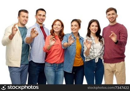 gesture, friendship and people concept - group of smiling friends showing ok hand sign over white background. group of smiling friends