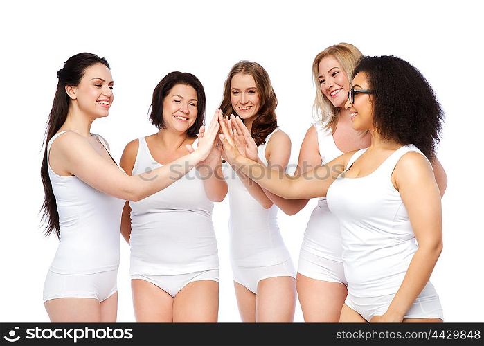 gesture, friendship, beauty, body positive and people concept - group of happy different women in white underwear making high five