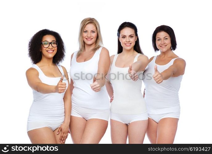 gesture, friendship, beauty, body positive and people concept - group of happy different women in white underwear showing thumbs up