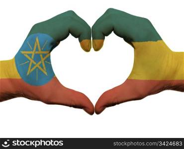 Gesture made by ethiopia flag colored hands showing symbol of heart and love, isolated on white background