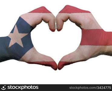 Gesture made by puerto rico flag colored hands showing symbol of heart and love, isolated on white background