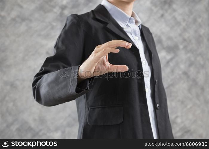 gesture of businesswoman hand holding something for use as business concept