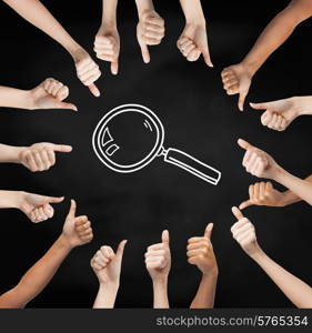 gesture, people and exploration concept - human hands showing thumbs up in circle over black board background with magnifier
