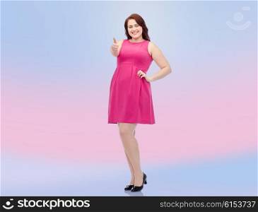 gesture, portrait and people concept - smiling happy young plus size woman posing in pink dress showing thumbs up over rose quartz and serenity gradient background