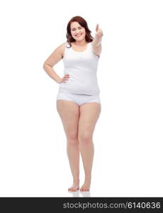 gesture, weight loss and people concept - smiling young plus size woman in underwear showing thumbs up