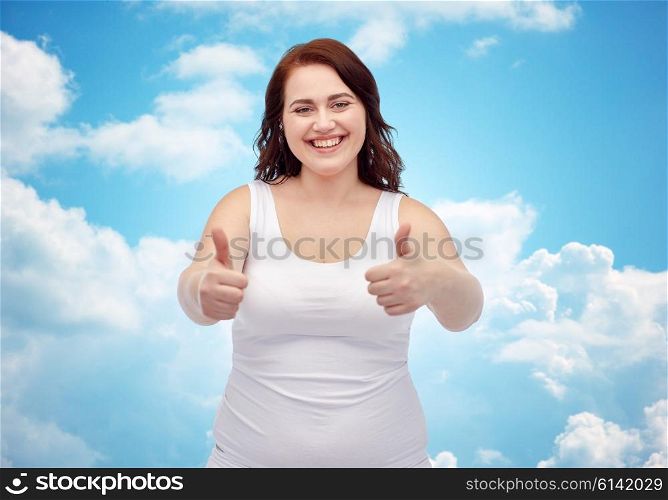 gesture, weight loss and people concept - smiling young plus size woman in underwear showing thumbs up over blue sky and clouds background