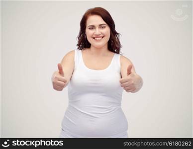 gesture, weight loss and people concept - smiling young plus size woman in underwear showing thumbs up over gray background