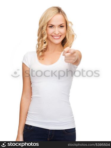 gestures and people concept - happy woman in blank white t-shirt pointing at you