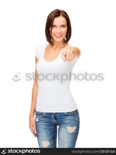 gestures and people concept - happy woman in blank white t-shirt pointing at you. happy woman in blank white t-shirt pointing at you