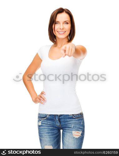 gestures and people concept - happy woman in blank white t-shirt pointing at you. happy woman in blank white t-shirt pointing at you