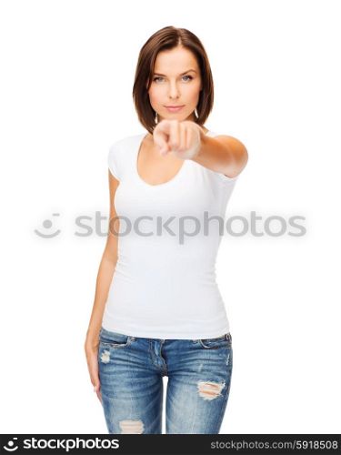 gestures and people concept - woman in blank white t-shirt pointing at you. woman in blank white t-shirt pointing at you