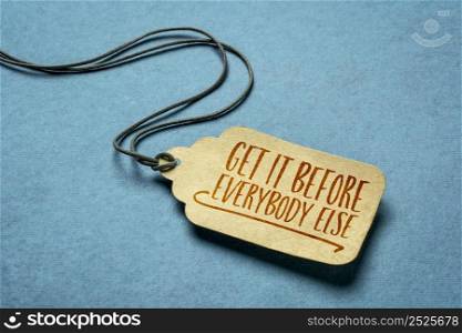 get it before everybody else - a paper price tag with a twine on blue background, sale, marketing and shopping concept