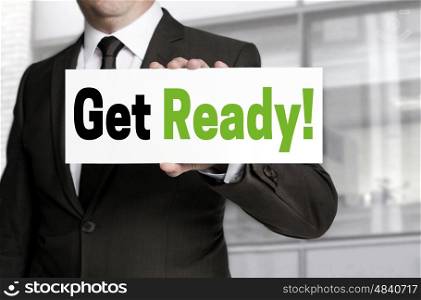 Get ready sign is held by businessman concept. Get ready sign is held by businessman concept.