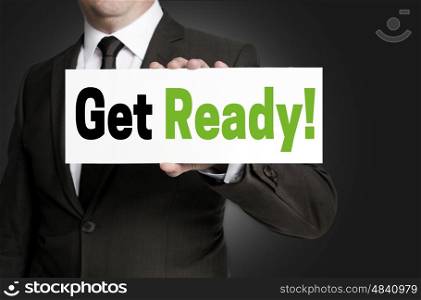 Get ready sign is held by businessman concept. Get ready sign is held by businessman concept.