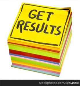 Get results reminder or advice- handwriting in black ink on an isolated stack of sticky notes