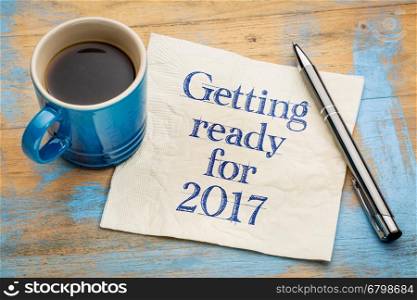 Getting ready for 2017 - handwriting on a napkin with a cup of espresso coffee