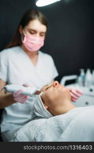 Getting rid of wrinkles in cosmetology clinic. Facial skincare in spa salon, health care. Rejuvenation procedure, beauty medicine. Getting rid of wrinkles in cosmetology clinic