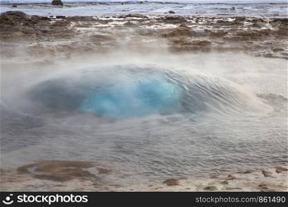 Geyser in Iceland is about to break out of the water