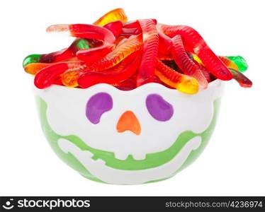 Ghoulish Hallowe&rsquo;en candy bowl with gummy worm hair. Shot on white background.
