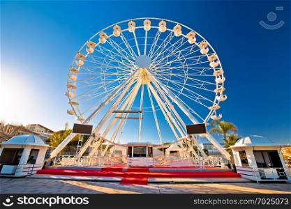 Giant Ferris wheel in Antibes colorful view, landmarks of French riviera, Alpes Maritimes department of France