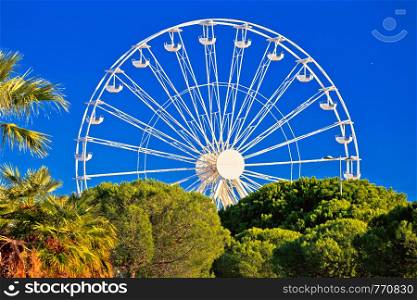 Giant Ferris wheel in Antibes colorful view, landmarks of French riviera, Alpes Maritimes department of France