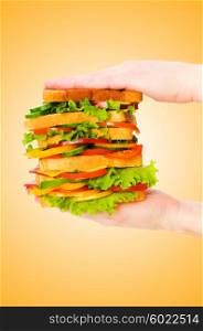 Giant sandwich against gradient background