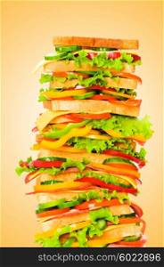 Giant sandwich against gradient background