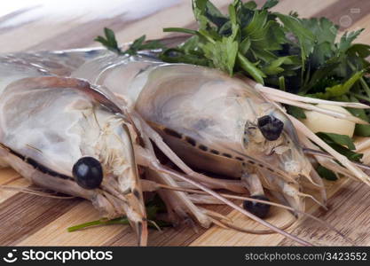 Giant shrimp on a wooden cutting board bamboo