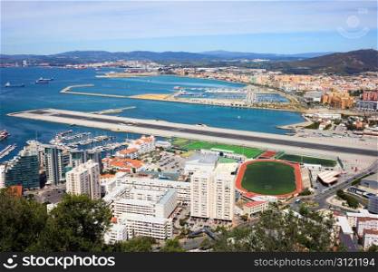 Gibraltar city and airport runway and La Linea de la Concepcion in Spain.