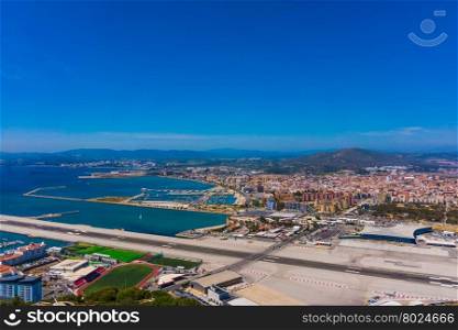 Gibraltar city and airport runway and La Linea de la Concepcion in Spain