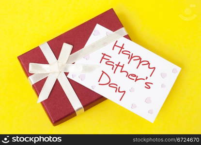 gift box and father&rsquo;s day card on yellow background